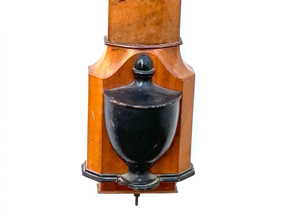 A wall-mounted antique Georgian stick barometer crafted from figured satinwood, featuring a brass finial, pediment top, and glass-fronted silvered scale. View VI