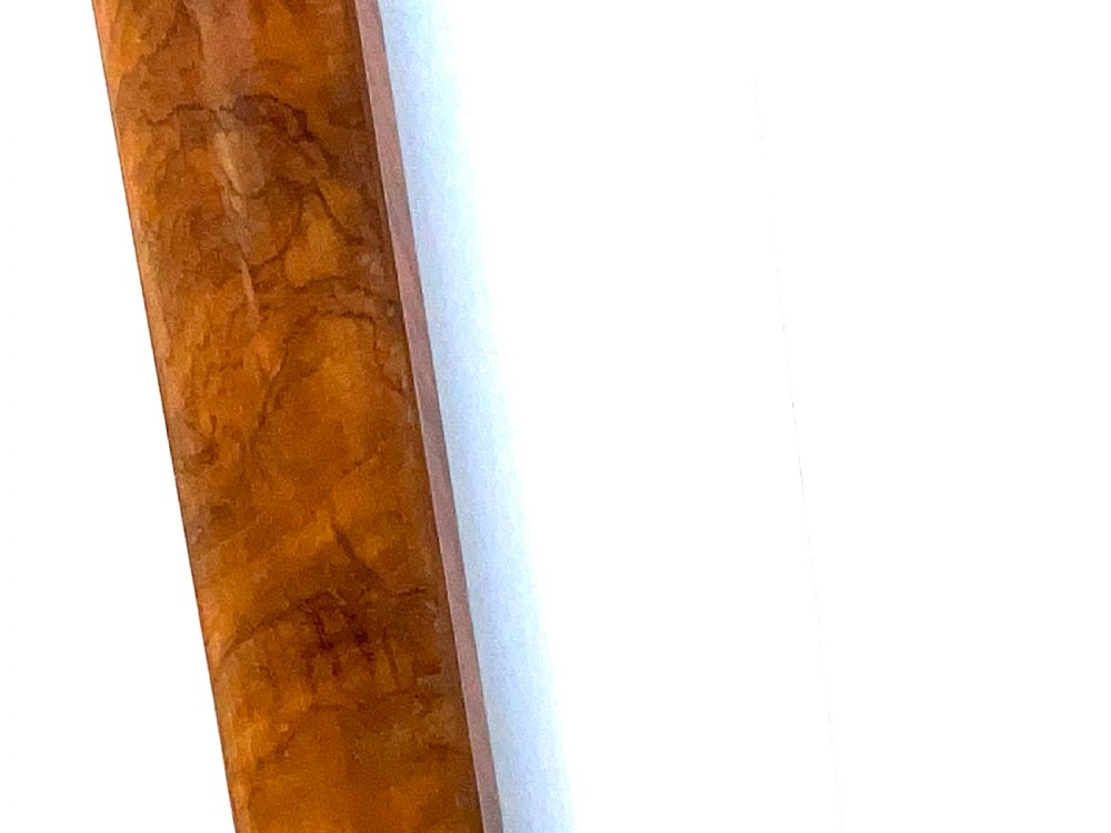 A wall-mounted antique Georgian stick barometer crafted from figured satinwood, featuring a brass finial, pediment top, and glass-fronted silvered scale. View VIII