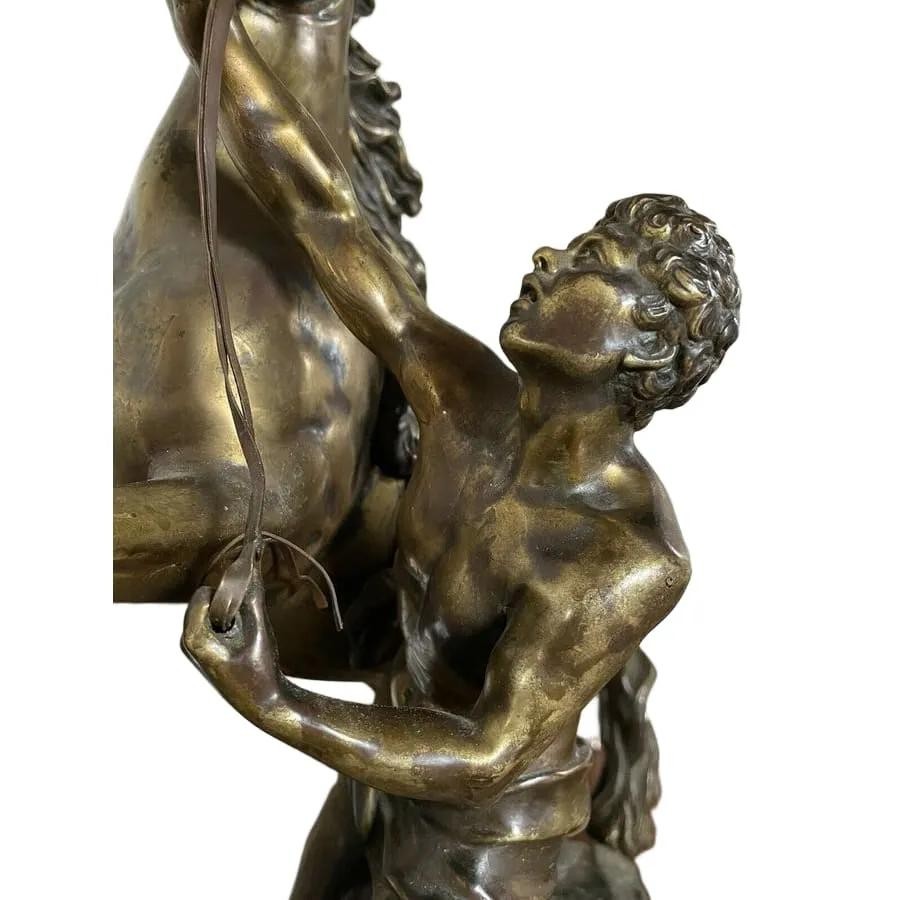 A pair of detailed gilt-bronze sculptures depicting rearing horses held by classical male handlers on naturalistic bases. View III