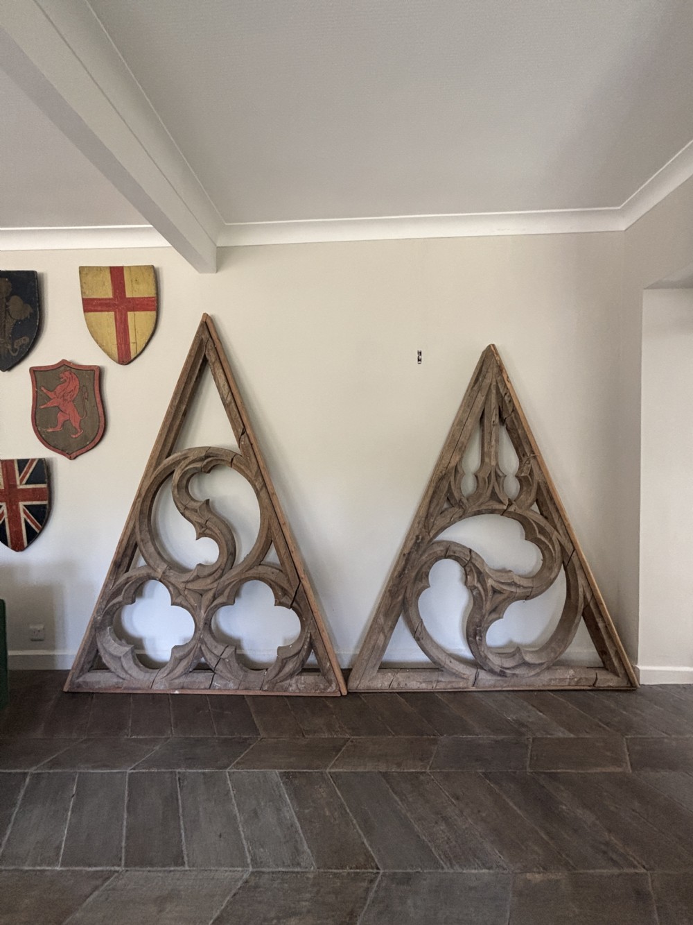 A large triangular hand-carved pine tracery panel featuring intricate gothic arches and circular pierced motifs. View II