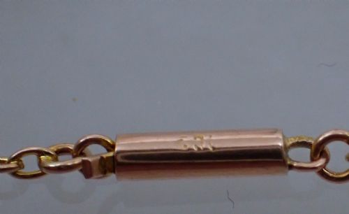 fig 2. An antique Victorian 9ct rose gold chain composed of alternating cylindrical bar links and coiled wirework scrolls.
