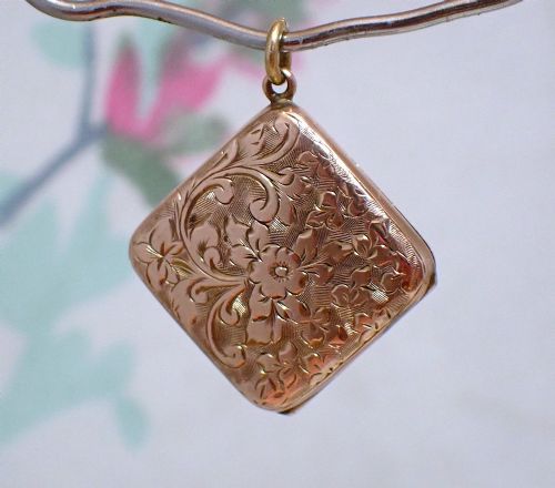 fig 1. An antique Victorian square rose gold double fronted locket with hand engraved floral patterns and a heart cartouche.