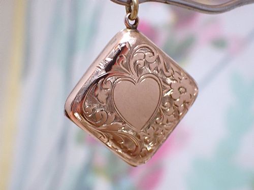 fig 2. An antique Victorian square rose gold double fronted locket with hand engraved floral patterns and a heart cartouche.