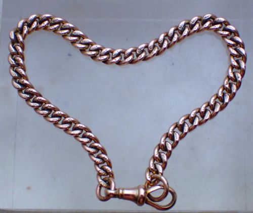 fig 1. An Edwardian 9ct rose gold curb link bracelet featuring interlocking links and a traditional swivel clasp closure.