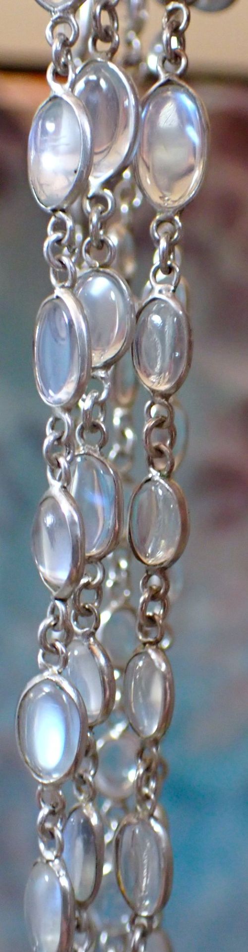 fig 1. An antique Arts and Crafts sterling silver double-strand necklace featuring bezel-set oval cabochon moonstones linked together by wire chain loops.