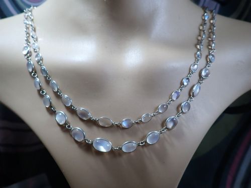 fig 3. An antique Arts and Crafts sterling silver double-strand necklace featuring bezel-set oval cabochon moonstones linked together by wire chain loops.