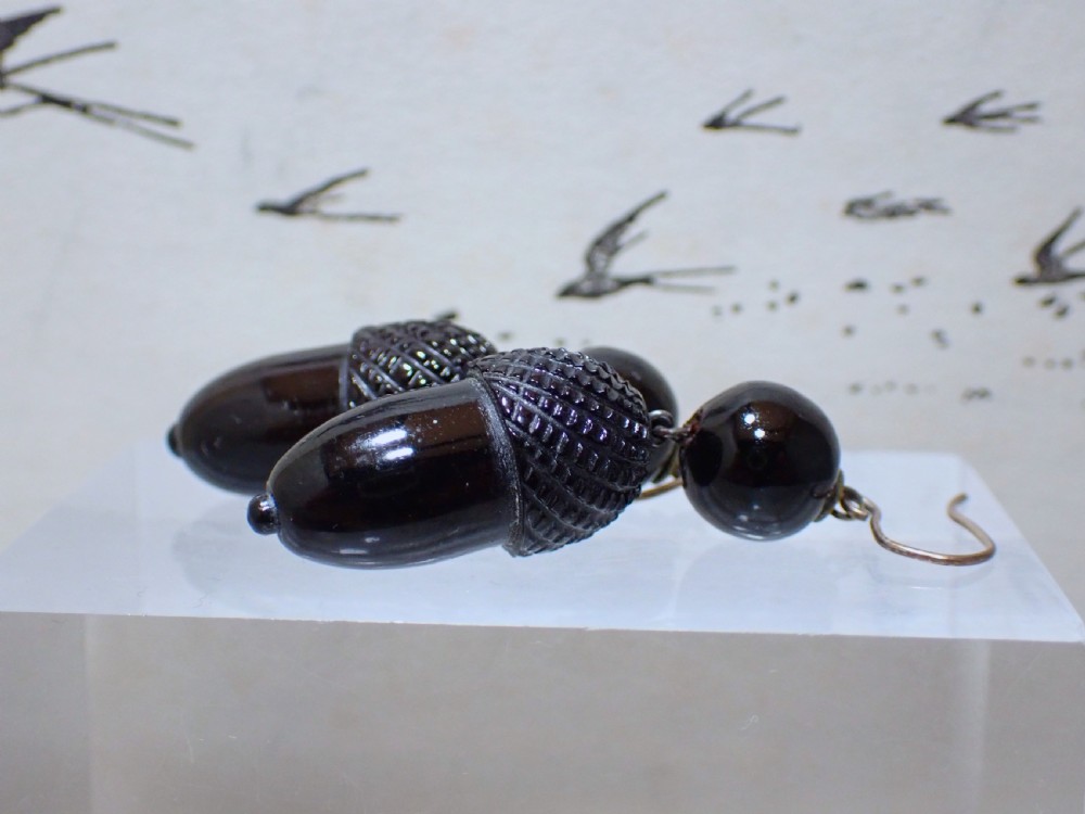 Pair of Victorian drop earrings featuring hand-carved black Whitby jet acorns beneath smooth round jet beads, fitted with 9ct gold ear wires. View II