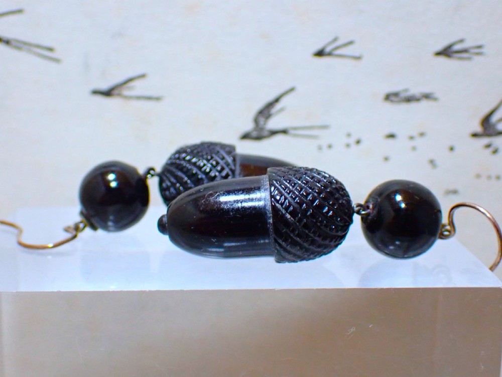 Pair of Victorian drop earrings featuring hand-carved black Whitby jet acorns beneath smooth round jet beads, fitted with 9ct gold ear wires. View IV