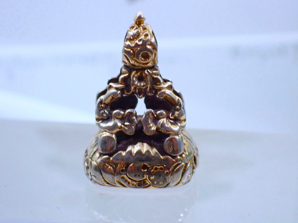 A Georgian gold cased fob seal featuring a carved red carnelian intaglio depicting a galloping horse under the engraved word SPEED. View III
