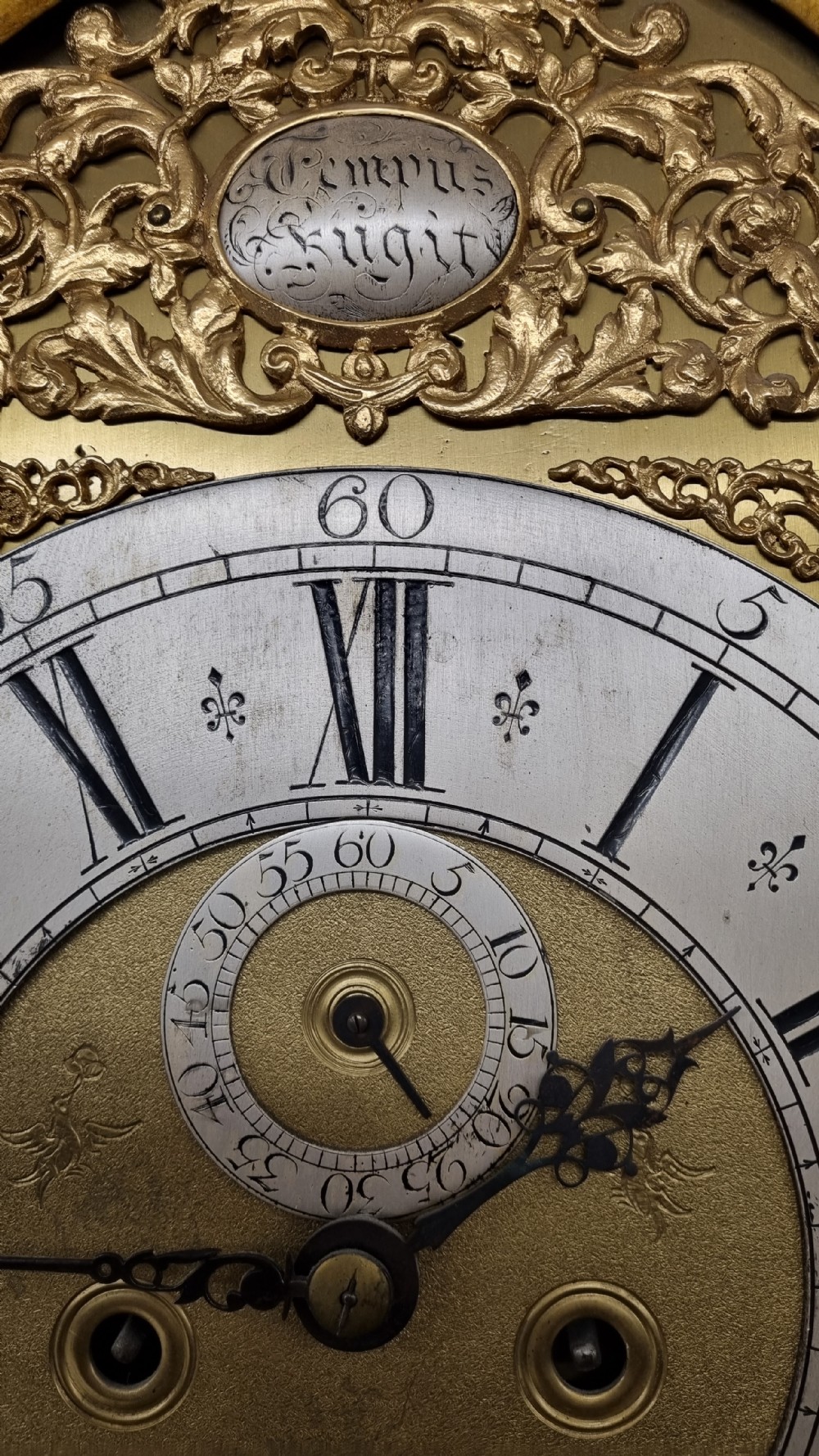 An 18th-century green and gold Japanned longcase clock featuring hand-painted Chinoiserie landscapes, an arched brass dial, and gilt finials. View VIII