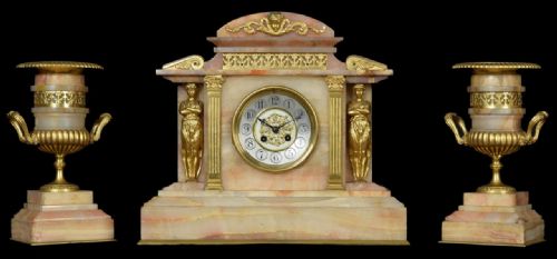 Late 19th Century French Gilt Metal and Onyx Cased Three Piece Clock Garniture