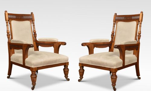 PAIR OF WALNUT UPHOLSTERED LIBRARY ARMCHAIRS
