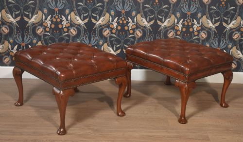 PAIR OF LEATHER UPHOLSTERED STOOLS