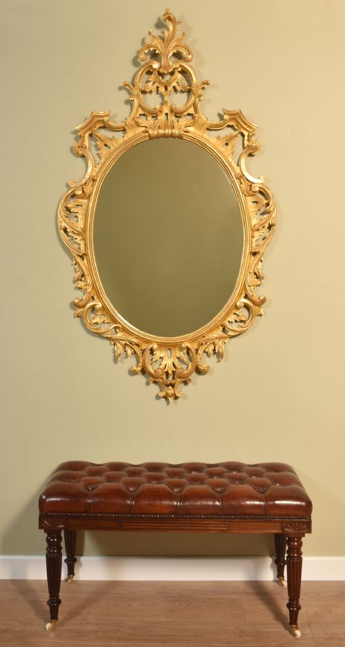 CARVED GILTWOOD OVAL WALL MIRROR - ADDITIONAL PHOTO 1