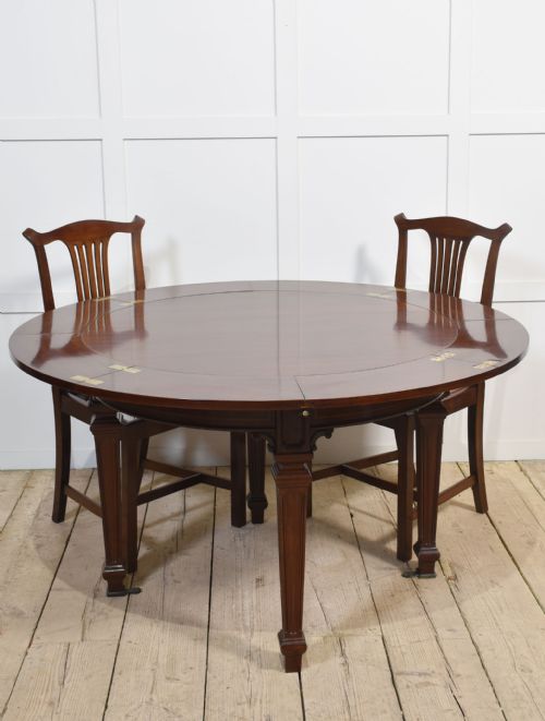 MAHOGANY CIRCULAR EXTENDING DINING TABLE - ADDITIONAL PHOTO 1