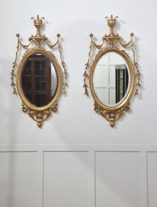 pair of adam style carved giltwood oval wall mirrors - CATEGORY: ANTIQUE MIRRORS - DATED 1910