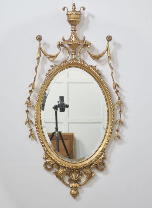 PAIR OF ADAM STYLE CARVED GILTWOOD OVAL WALL MIRRORS - ADDITIONAL PHOTO 1