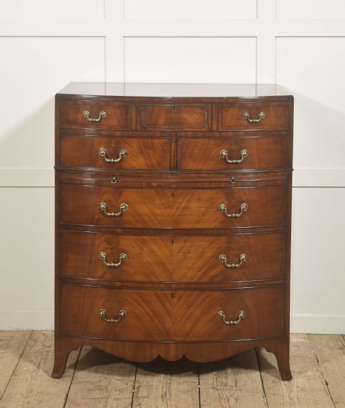 GEORGE III STYLE MAHOGANY SERPENTINE CHEST OF DRAWERS