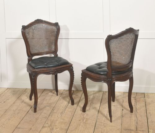 PAIR OF LOUIS XV STYLE CARVED WALNUT AND CANED SIDE CHAIRS - ADDITIONAL PHOTO 1