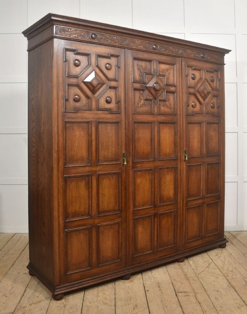 JACOBEAN REVIVAL CARVED OAK TRIPLEDOOR WARDROBE - ADDITIONAL PHOTO 9