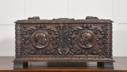 CARVED WALNUT COFFER WITH FIGURAL MEDALLIONS