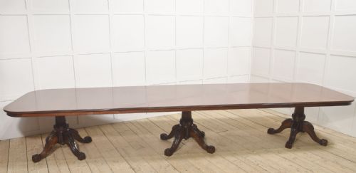 LARGE REGENCY REVIVAL TRIPLEPEDESTAL MAHOGANY DINING TABLE
