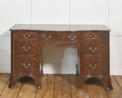 SERPENTINEFRONTED MAHOGANY DRESSING TABLE