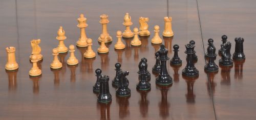 LATE 19TH CENTURY BOXWOOD AND EBONISED STAUNTON CHESS SET