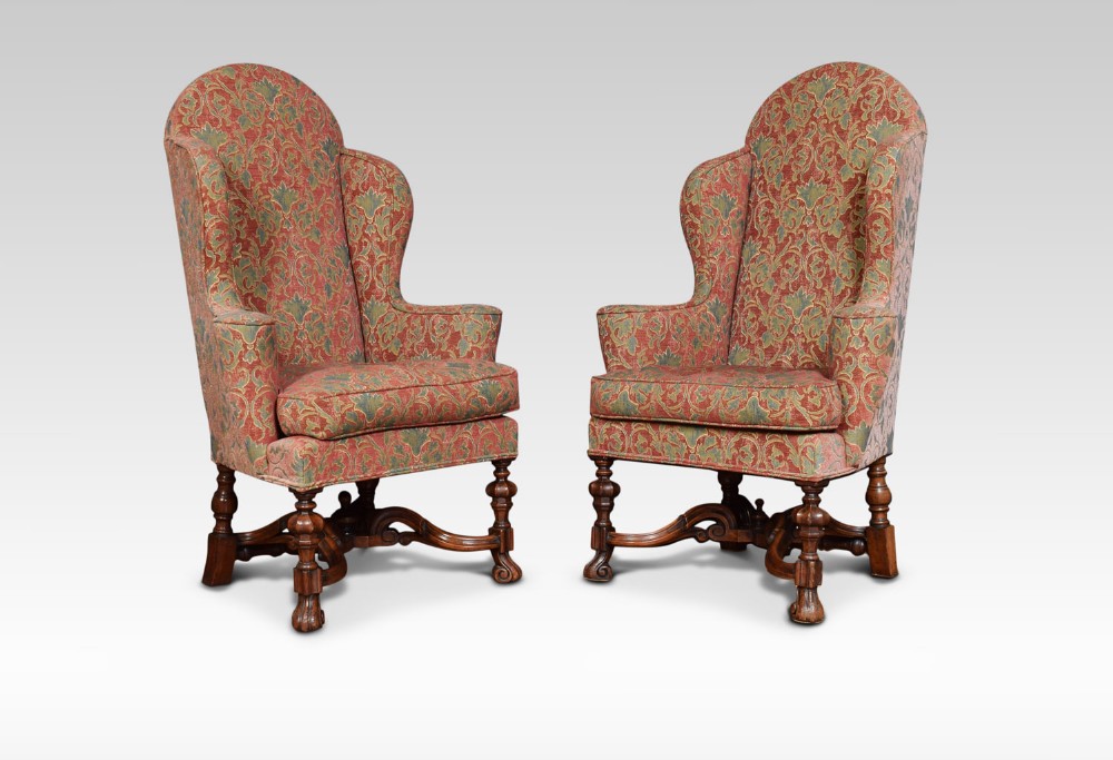 Pair of walnut framed Carolean style wing armchairs