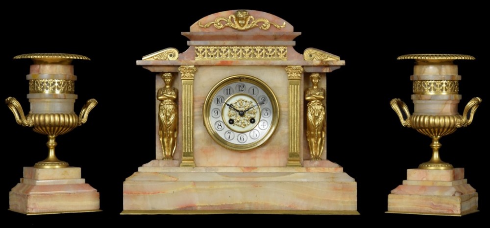 Late 19th Century French gilt metal and onyx cased three piece clock garniture