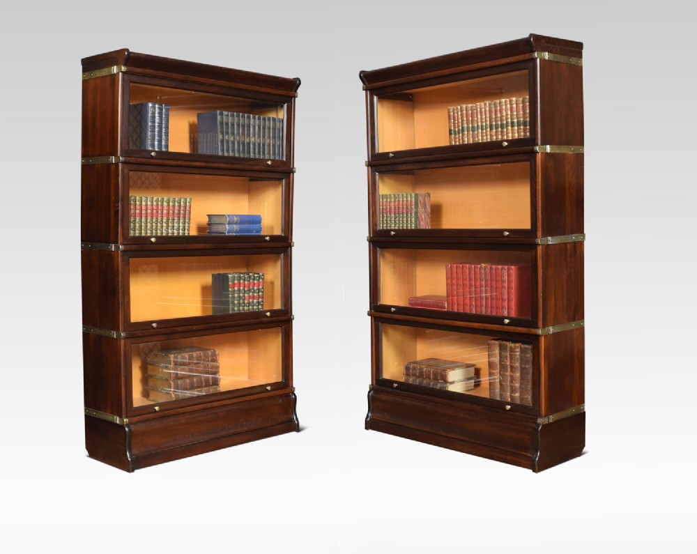 Pair of mahogany globe Wernicke four section bookcases