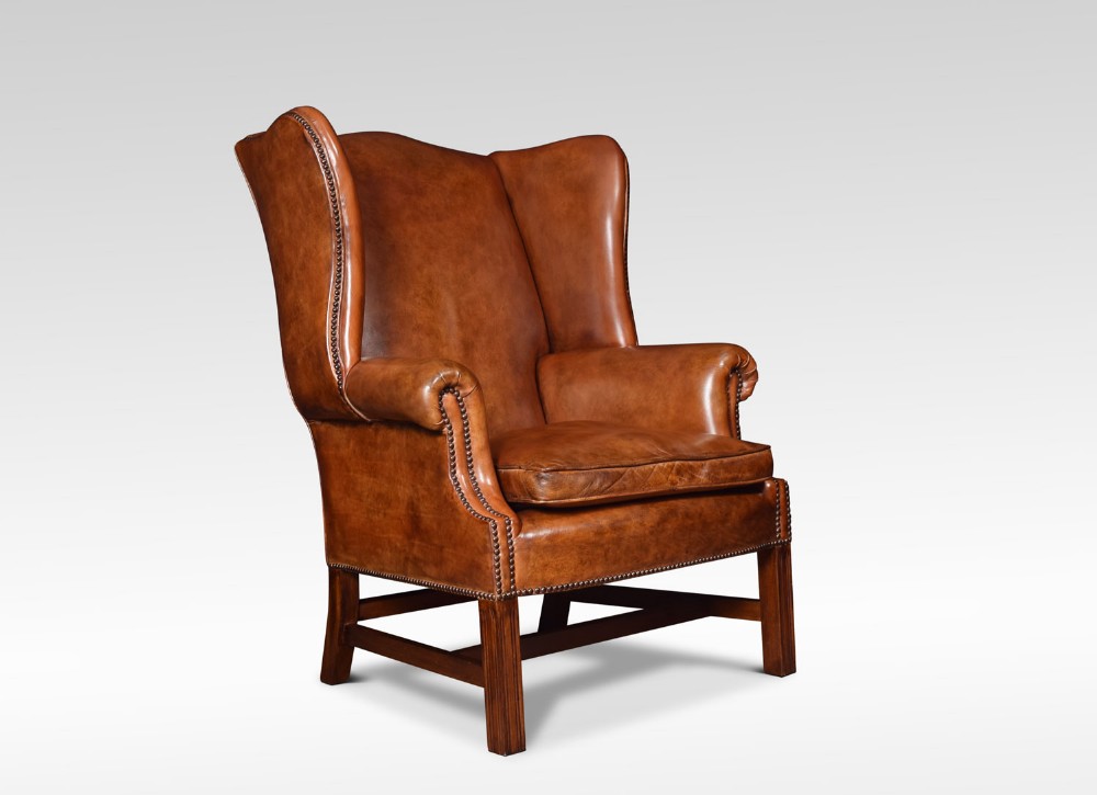 Leather upholstered wingback armchair