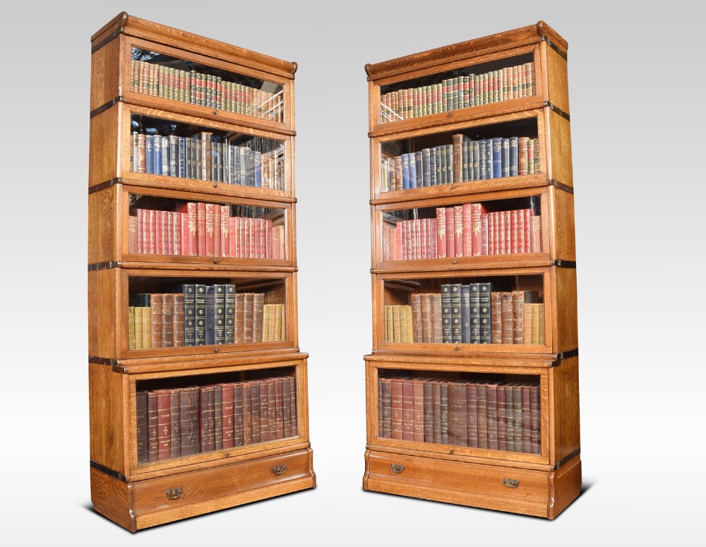 Pair of oak globe Wernicke five section bookcases