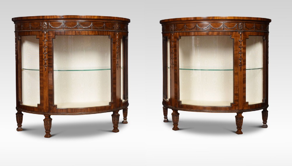 Pair of Neo Classical style mahogany demilune display cabinets