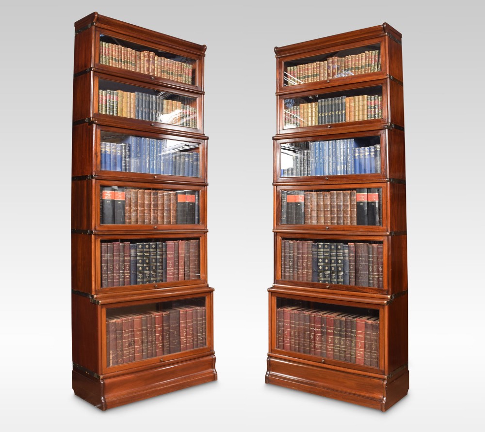 Pair of mahogany globe Wernicke six section bookcases