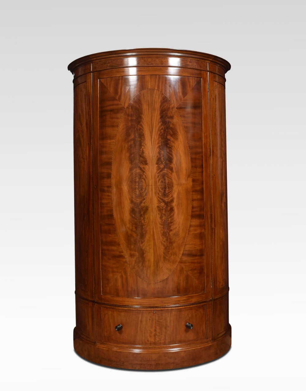 Edwardian mahogany bow fronted wardrobe by Maple and Co