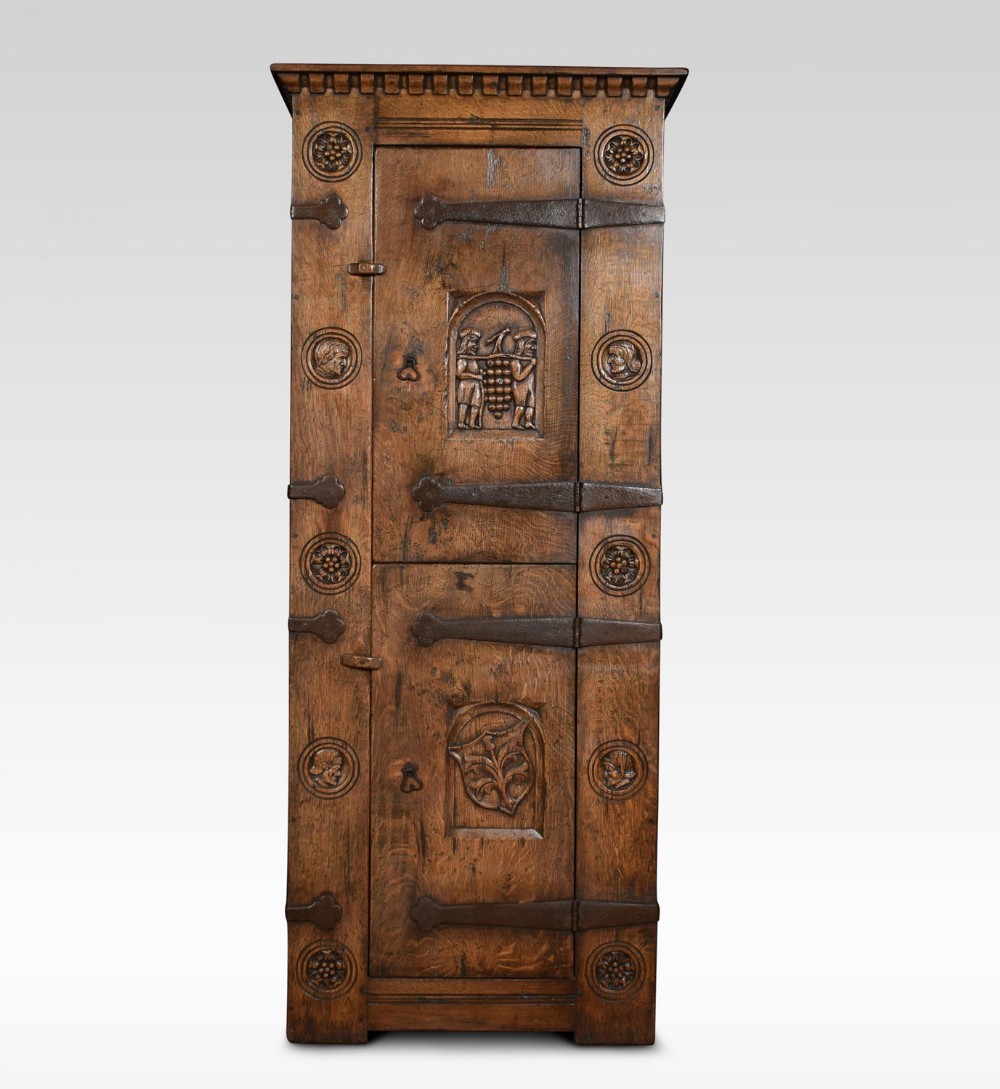 Carved oak two door cupboard