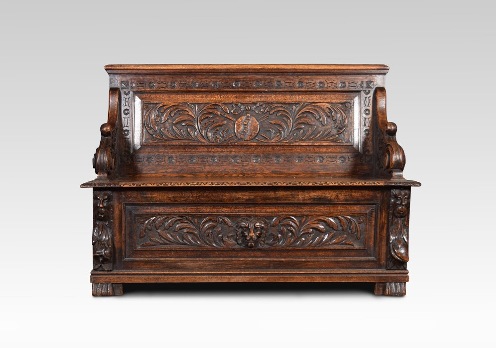 Carved oak hall settle