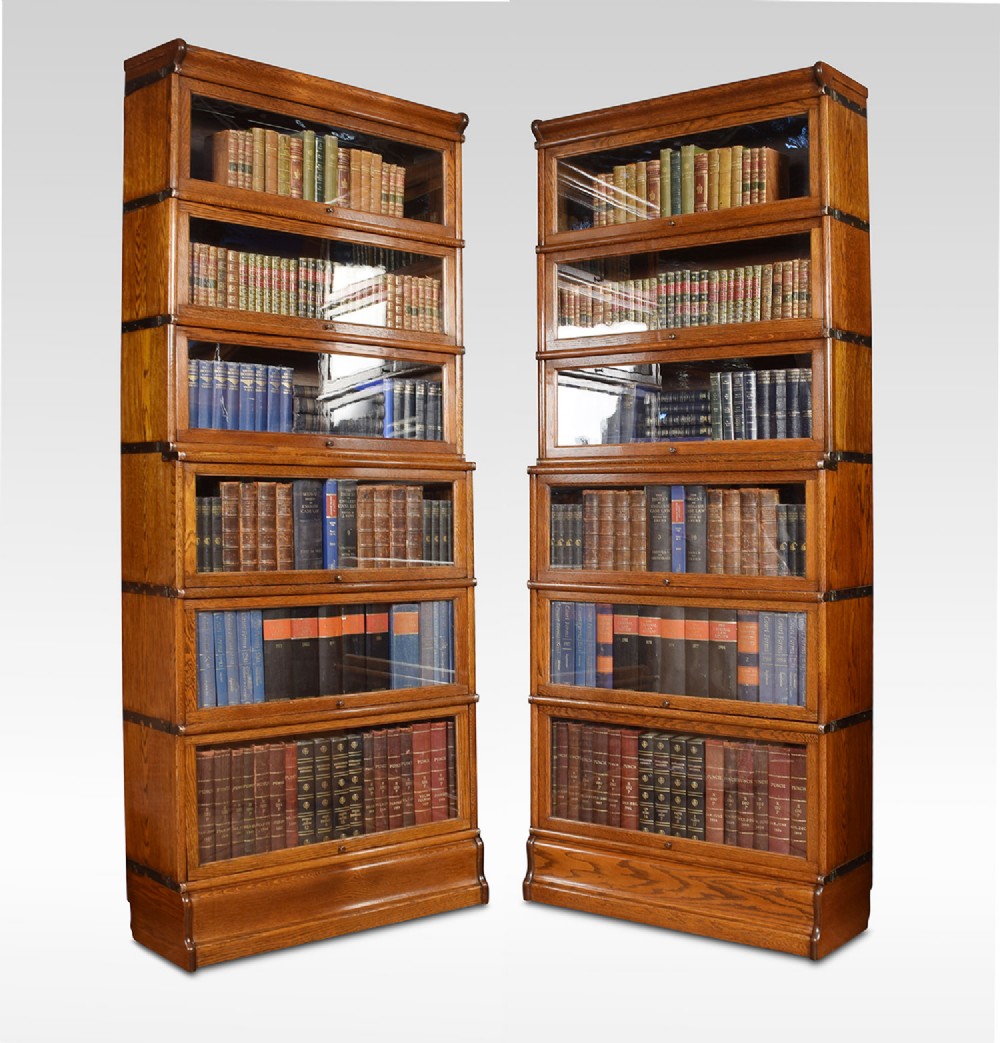 Pair of oak globe Wernicke six section bookcases