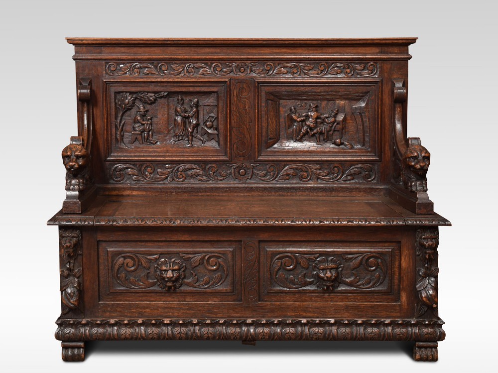 Carved oak hall settle