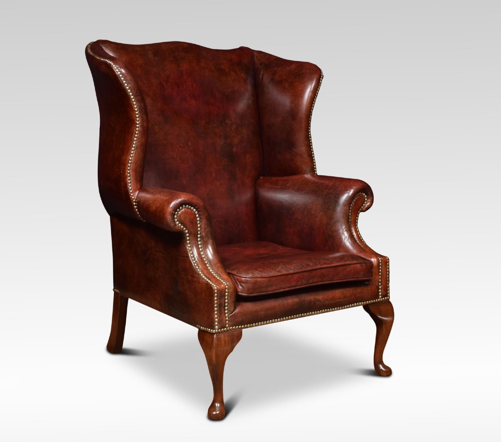 Large Leather upholstered wingback armchair