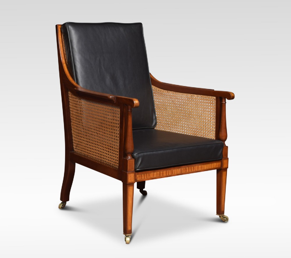 George IV mahogany and satinwood inlaid bergere armchair