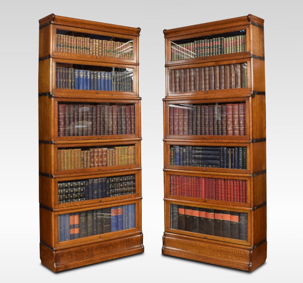 Pair of oak globe Wernicke six section bookcases