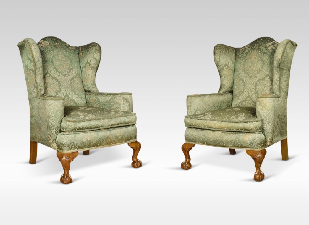 Pair of George III style wing armchairs