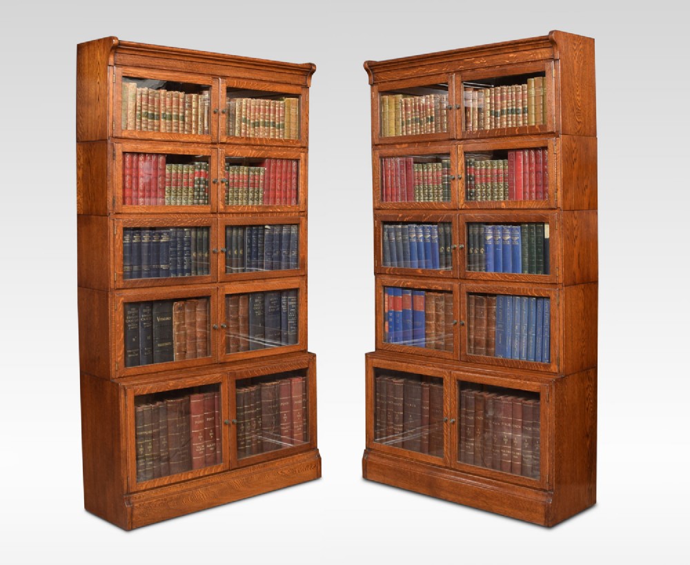 Pair of large oak sectional bookcases