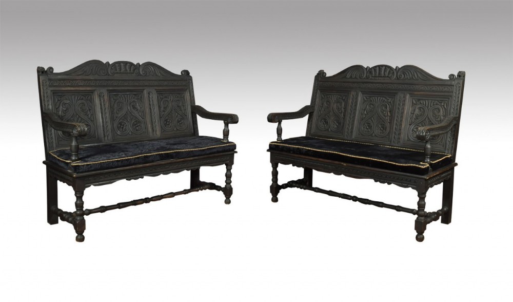 Pair carved ebonised hall benches