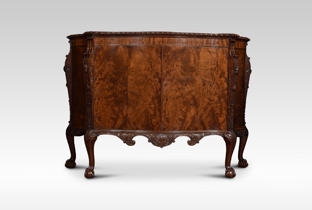 George III style serpentine mahogany sideboard