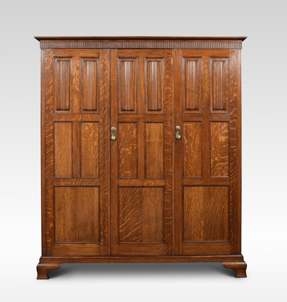 Carved oak three door hall robe