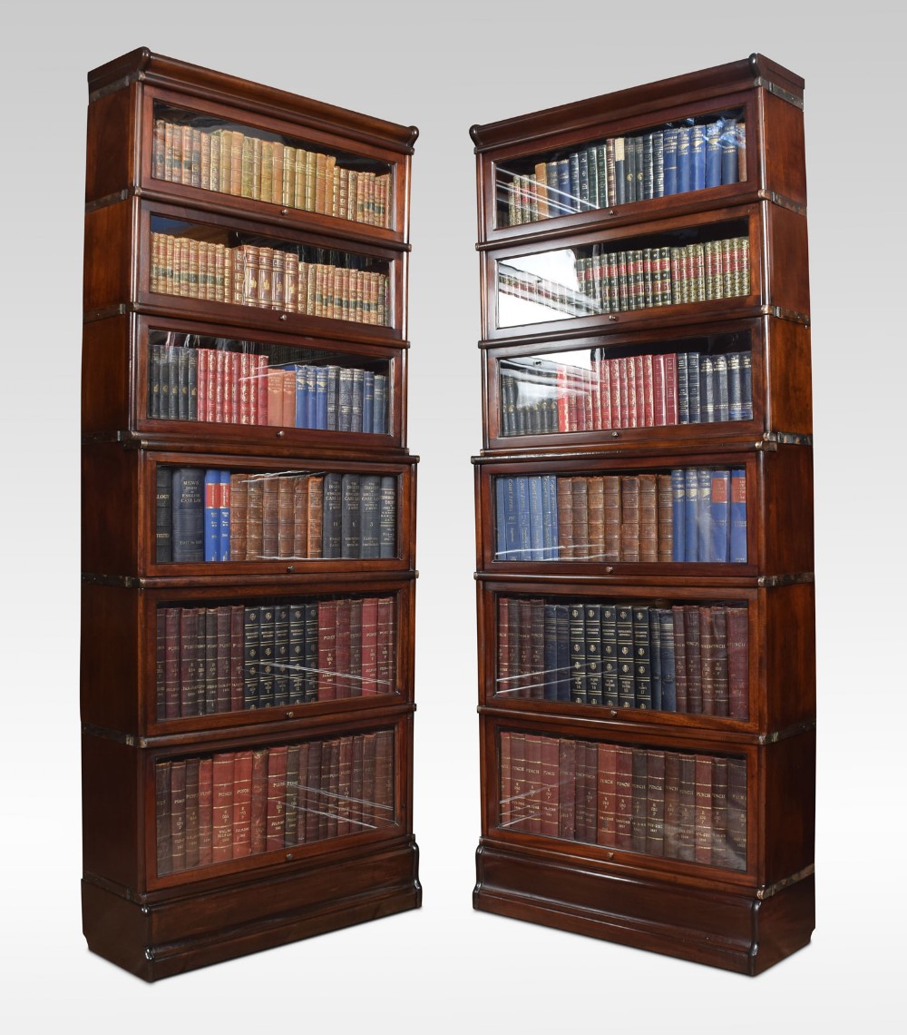 Pair of mahogany globe Wernicke six section bookcases