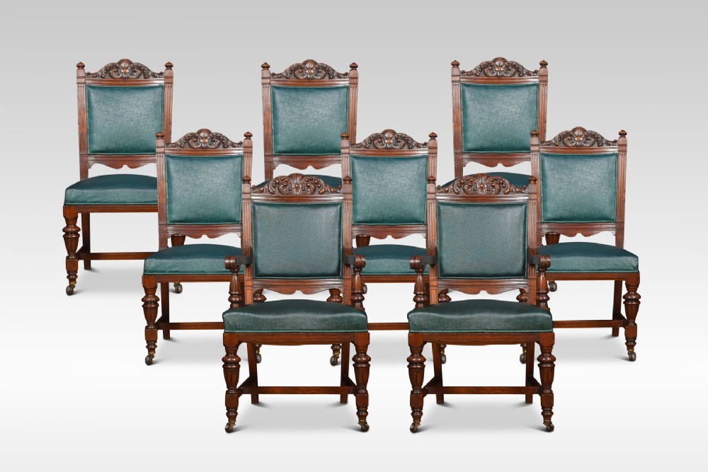 Set of eight carved walnut dining chairs